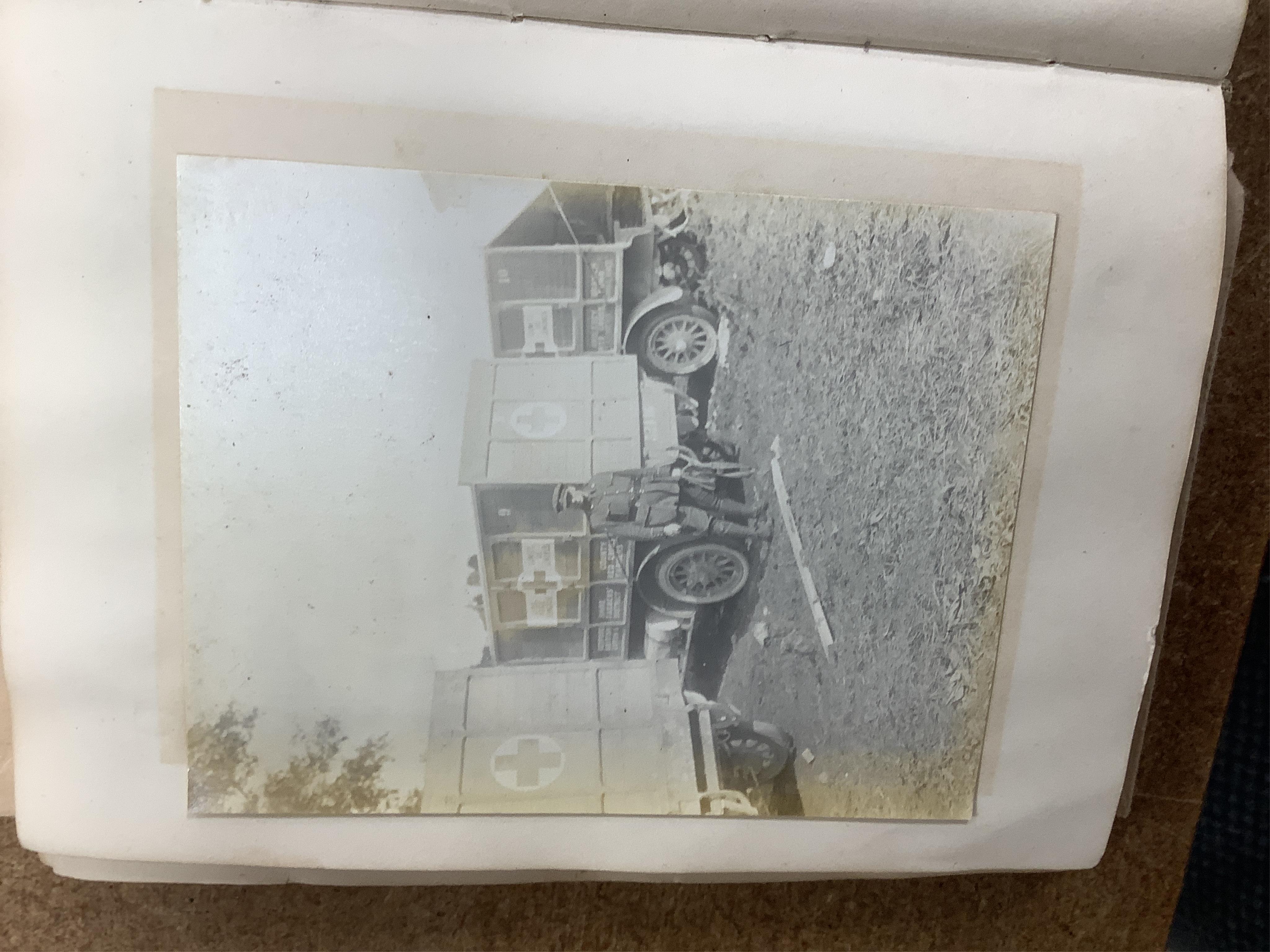 A WWI Ambulance and Balloon Brigade photograph album, pocket watch, coin, etc. Condition - fair, pocket watch ticks when wound